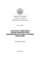 Low-level turbulence characteristics over inhomogeneous surface during wintertime